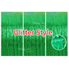 Three panels of shimmering green glitter fringe curtains used as a party backdrop decor