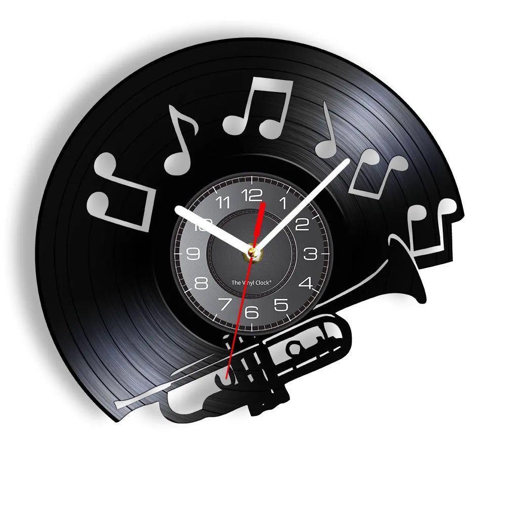 A black vintage vinyl record wall clock featuring a rotating record and musical notes.