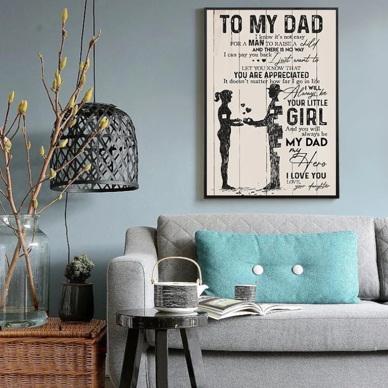 A framed canvas print featuring a heartfelt quote to a dad with silhouette illustrations on a gray wall.