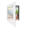 A white magnetic front opening art display frame showing a colorful beach scene with a sailboat and palm tree.