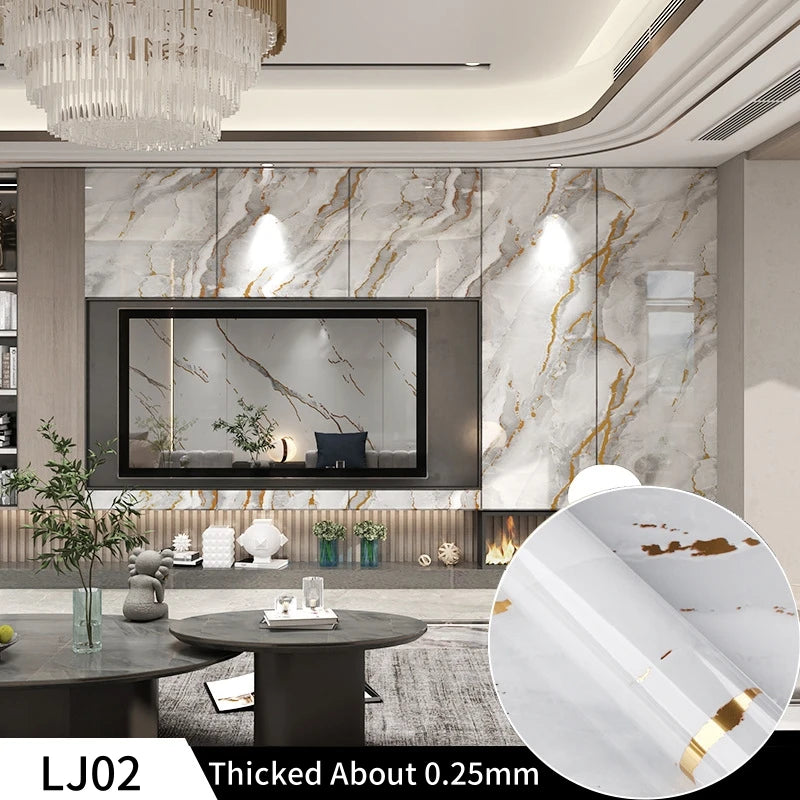 A close-up view of gold marble contact paper showing a textured surface and natural veining.