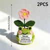Two hand crocheted flower ornaments featuring pink flowers and green leaves.