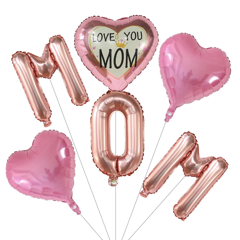 A set of six pink foil balloons spelling out LOVE YOU MOM and the number zero for a Mother's Day decoration.