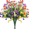 A vibrant bouquet of artificial calla lilies featuring mixed colors including orange, purple, pink, and white.