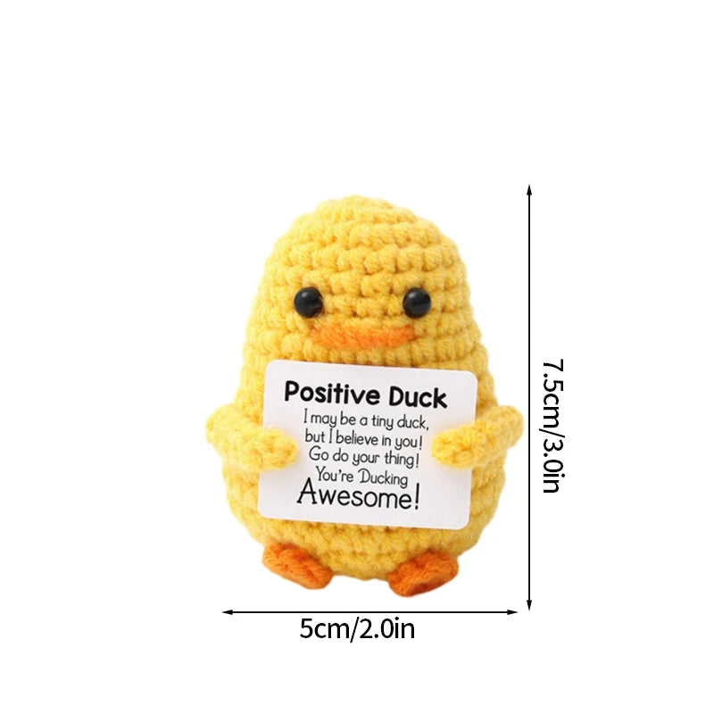 Handmade crochet positive duck doll in yellow with an inspirational slogan tag