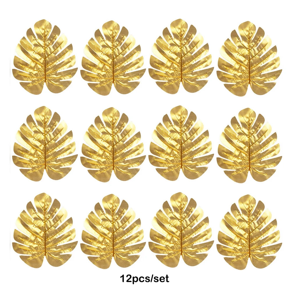 Twelve artificial golden tropical palm leaves used for party decoration