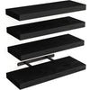 A set of three black wooden floating wall shelves with a mounting bracket.
