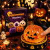 An orange glowing pumpkin Halloween simulation toy is held in a wooden tray surrounded by spooky decorations.