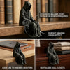 A dark hooded figure sits on a wooden surface, demonstrating perfect draping for a bookend or decorative item.