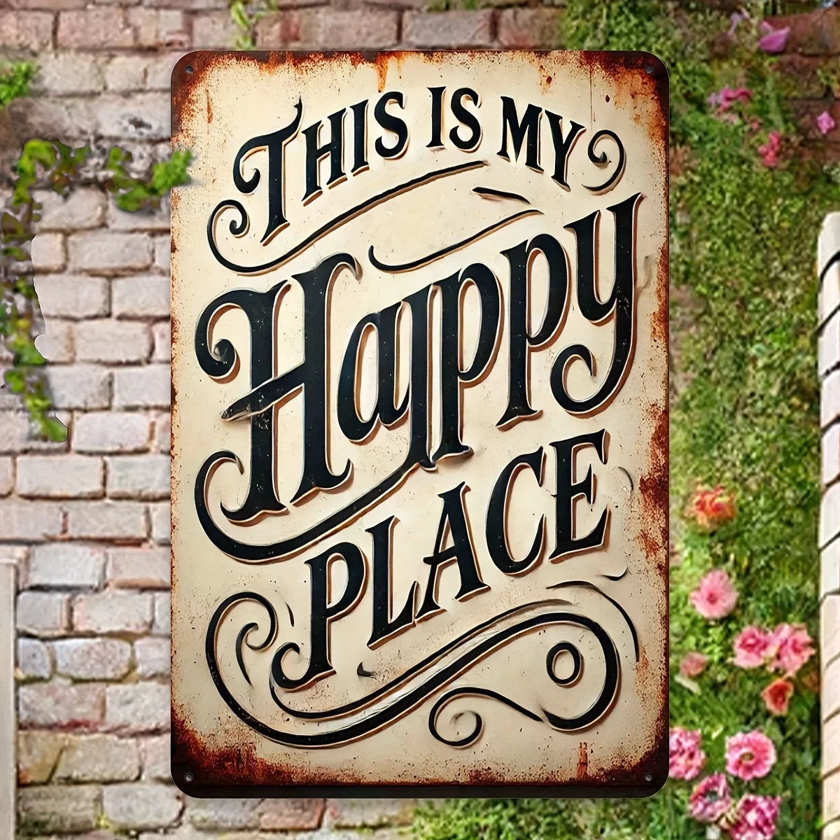 A rustic iron wall sign with carved text that reads This Is My Happy Place, set against a brick and greenery background.