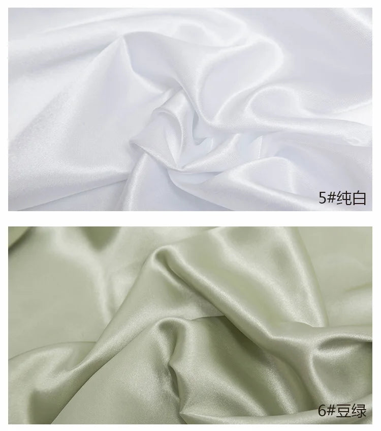 Two swatches of satin fabric are shown, one white and one light green, demonstrating the material's drape.