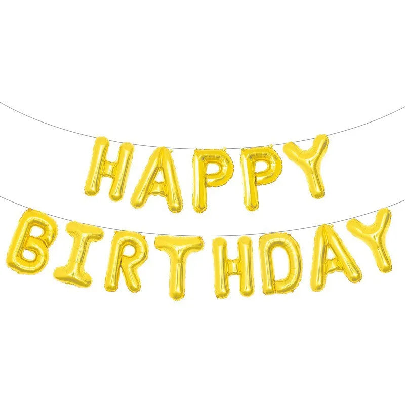 A string of gold foil letter balloons spelling out Happy Birthday for party decoration
