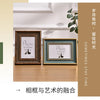 Two framed wooden art pieces featuring the text Home Is Where The Is displayed on a light wood surface