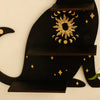 A black cat silhouette floating shelf featuring a sun motif and gold stars for crystals and decor.