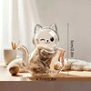 A clear capsule cat keepsake magnet shaped like a sitting kitten with wispy texture.