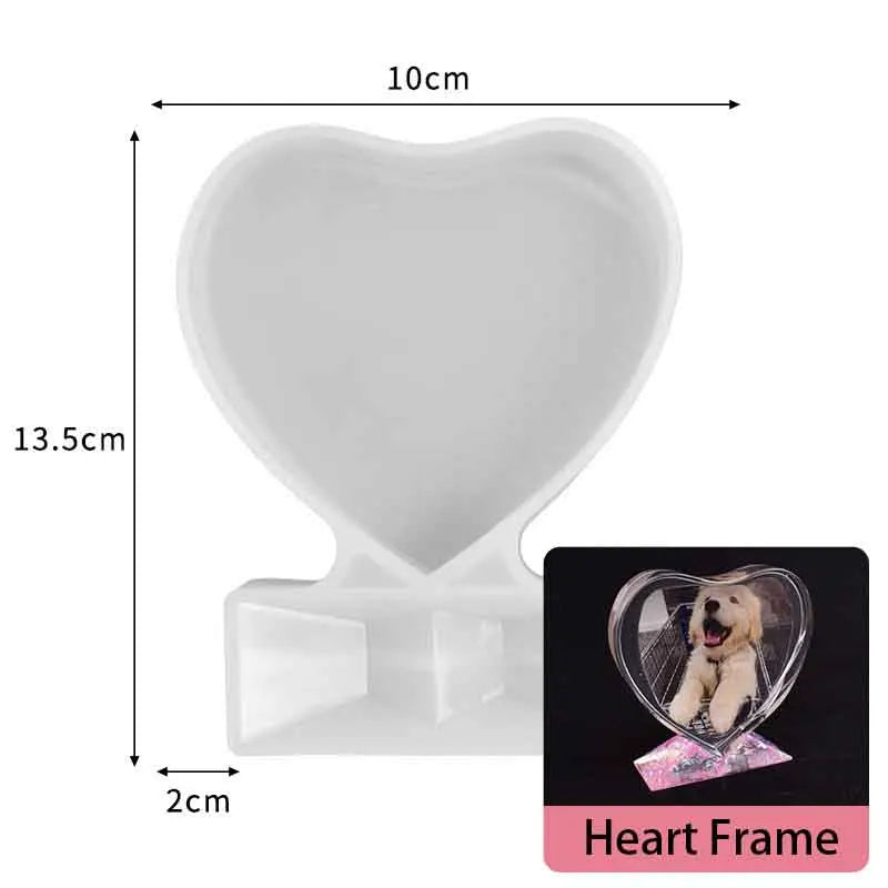 White heart-shaped silicone mold with a frame and a photo inside