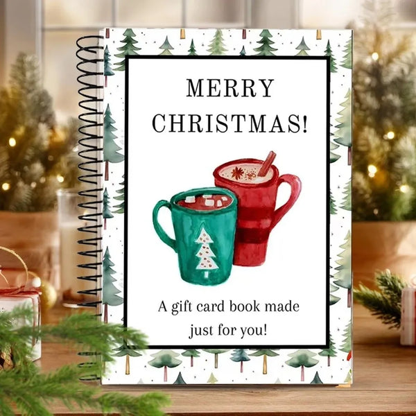 A spiral-bound gift card book featuring a festive Christmas design with a mug and evergreen trees.