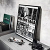A framed poster of the Vinland Saga anime featuring a character, displayed on a gray shelf.