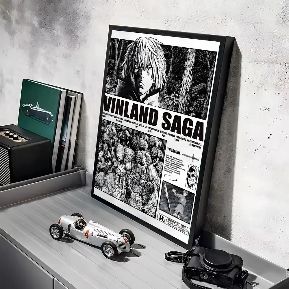 A framed poster of the Vinland Saga anime featuring a character, displayed on a gray shelf.