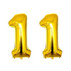 Two shiny gold foil number balloons shaped like the number one