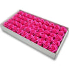 A rectangular box filled with numerous pink artificial rose flower heads for DIY crafts and decor