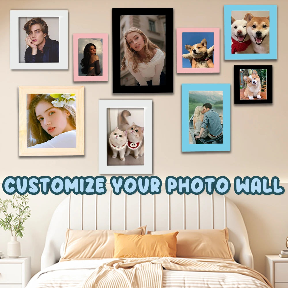 A collection of framed photos and artwork displayed on a wall above a bed.