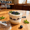 A set of 25 pudding cups with lids and spoons filled with blueberry mousse on a wooden table.
