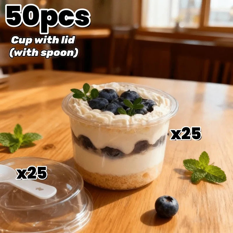 A set of 25 pudding cups with lids and spoons filled with blueberry mousse on a wooden table.