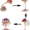 A crystal money tree decor featuring a branch with colorful crystals mounted on a stand.