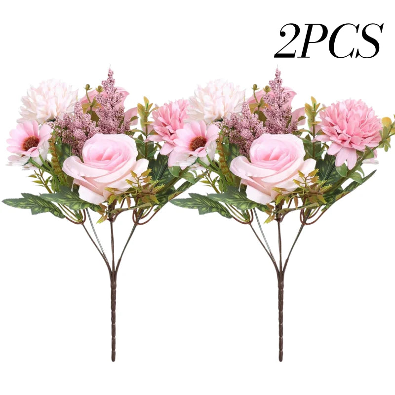 Two artificial silk rose and daisy bouquets featuring pink and purple flowers on green stems