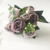 A bouquet of dusty mauve and green silk roses and peonies for home and event decor.
