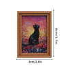 A framed painting featuring a black cat against a vibrant, colorful floral background.