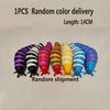 A collection of 14cm long, colorful, striped fidget slug toys in various colors laid out on a white background.