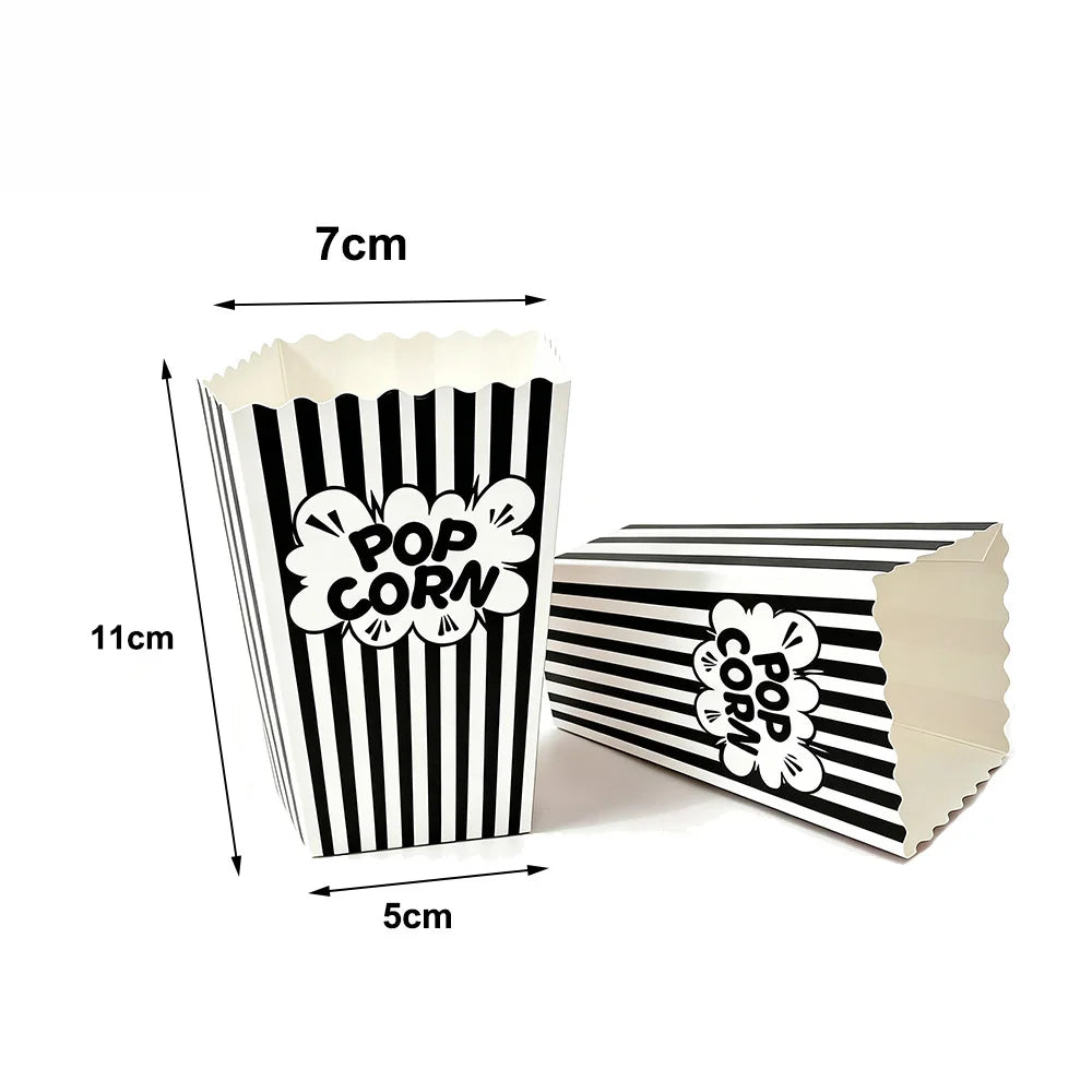 A vertical stack of black and white striped paper snack boxes with a cutout design.