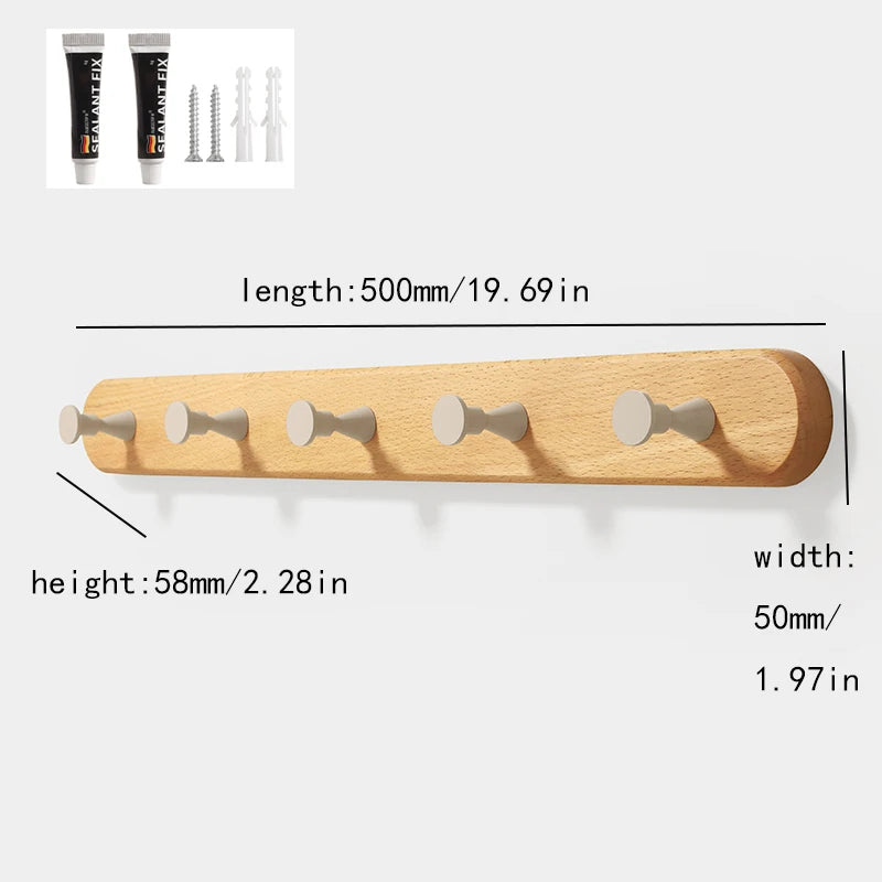 A light wood wall hook rack with four wooden hooks is shown alongside various nail and hook tools.