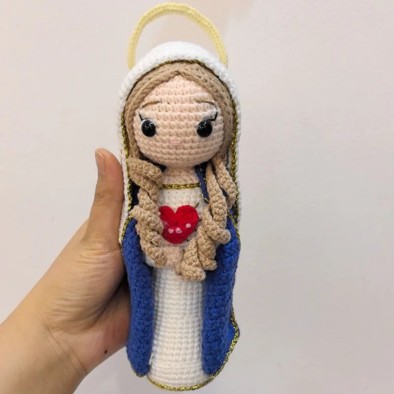 Handcrafted Virgin Mary crochet doll with a white veil and blue robe