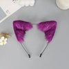 Purple plush fox ears headband with black nose bridge and dangling ears