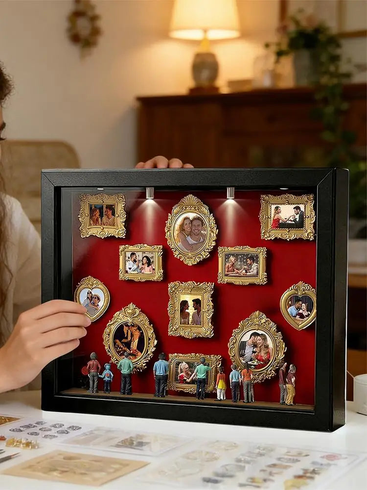A black display case featuring framed photos and figurines illuminated by an LED light.