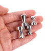A hand holds several silver neodymium magnetic pushpins with various shapes and sizes.
