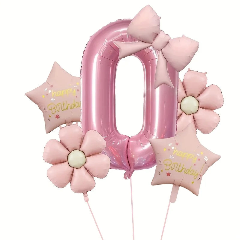 Pink foil number zero balloon decorated with pink bows and flowers for a birthday celebration