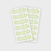 A sheet of light green stickers with the word sample repeated multiple times.