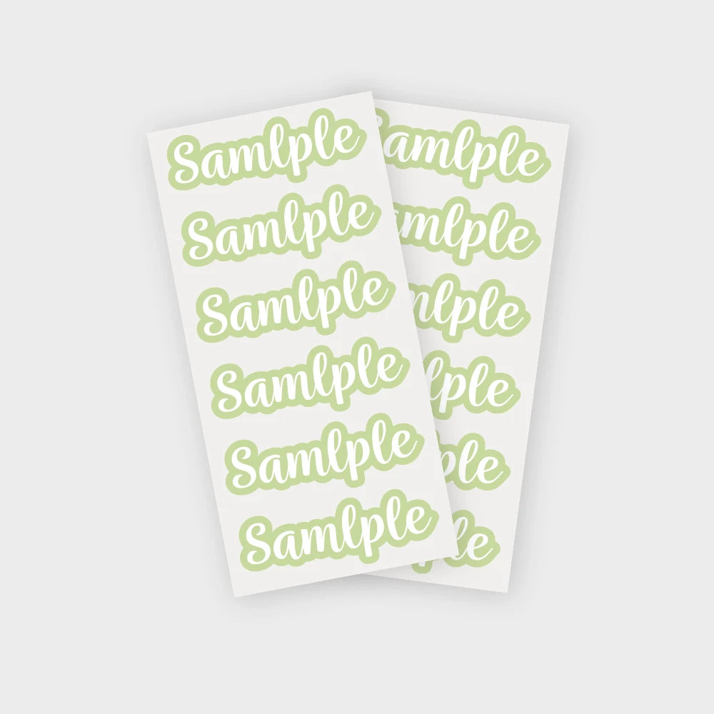 A sheet of light green stickers with the word sample repeated multiple times.