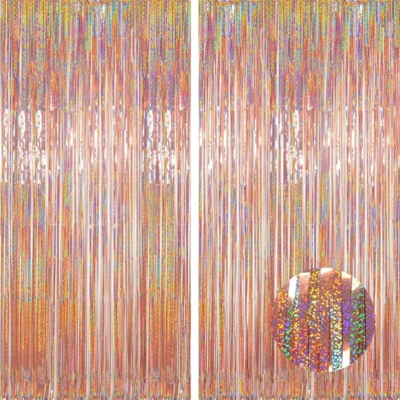 A vertical backdrop featuring shimmering metallic foil tinsel fringe in various colors.