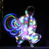 A person wearing a white LED light-up neon costume jacket and pants set against a dark background.