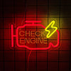A neon sign shaped like an engine with the words CHECK ENGINE glowing red and yellow against a dark grid background.