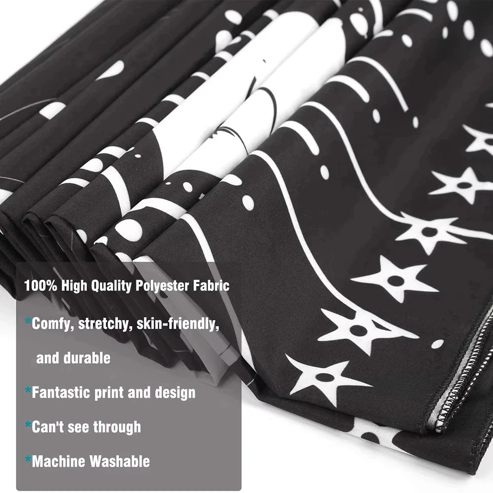 Black and white polyester fabric tapestry with a swirling design shown in a rolled stack.