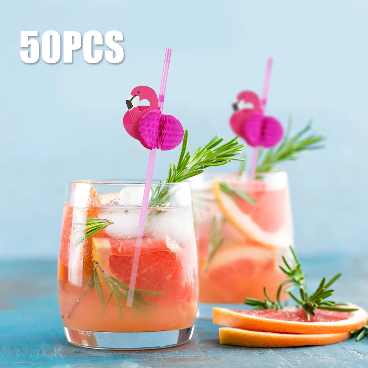 A glass of tropical drink garnished with a pink flamingo and pineapple paper straws.