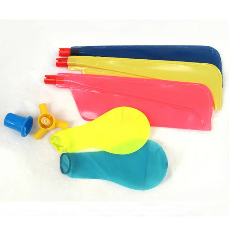 A collection of colorful whistling balloon helicopter toys in various shades including red, yellow, blue, and pink.