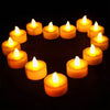 A set of glowing yellow LED tea light candles arranged in a circular pattern against a dark background.