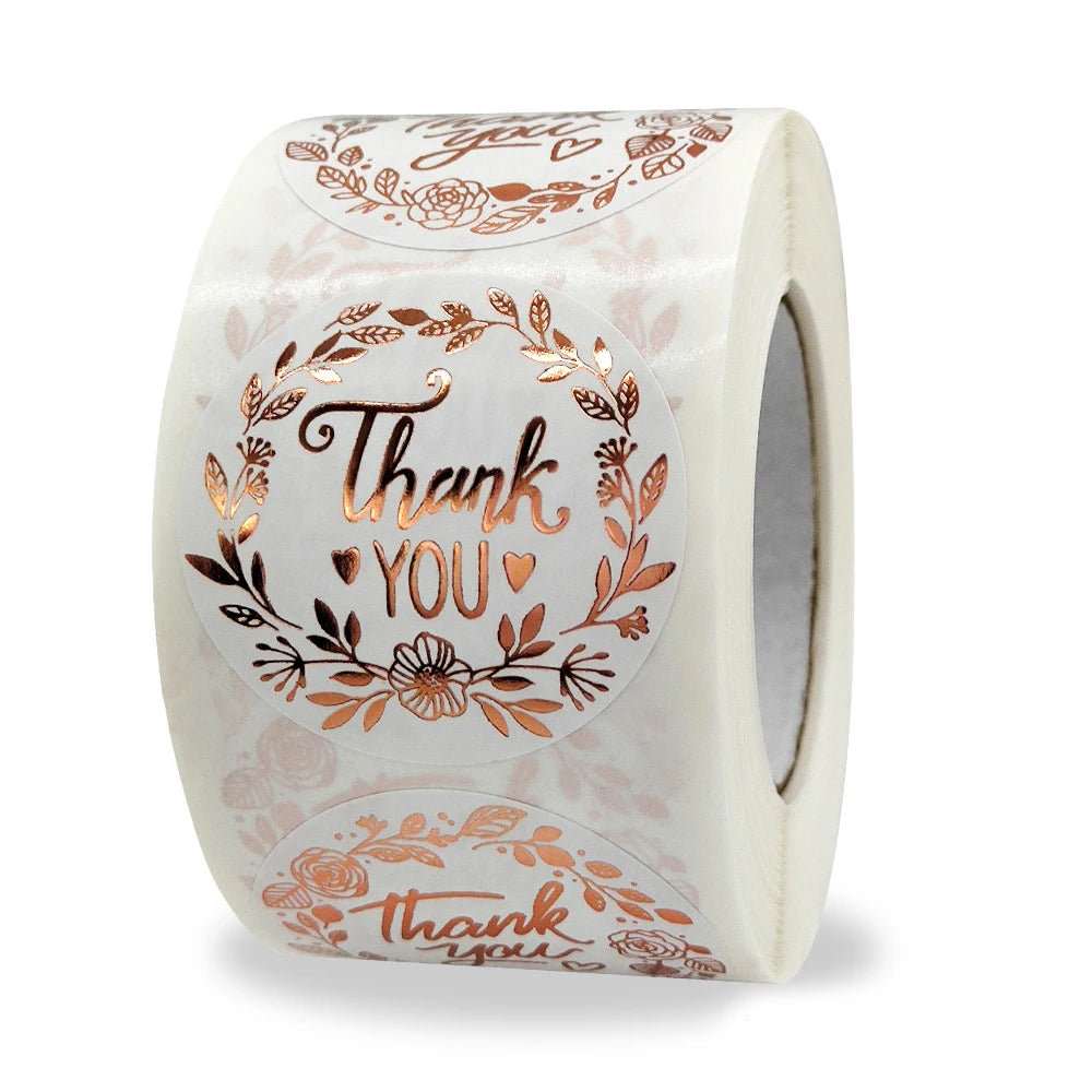 Roll of gold foil thank you sealing stickers with floral designs for envelopes and gifts
